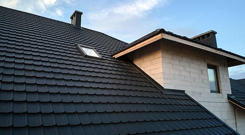 A Building With Black Roof Shingles