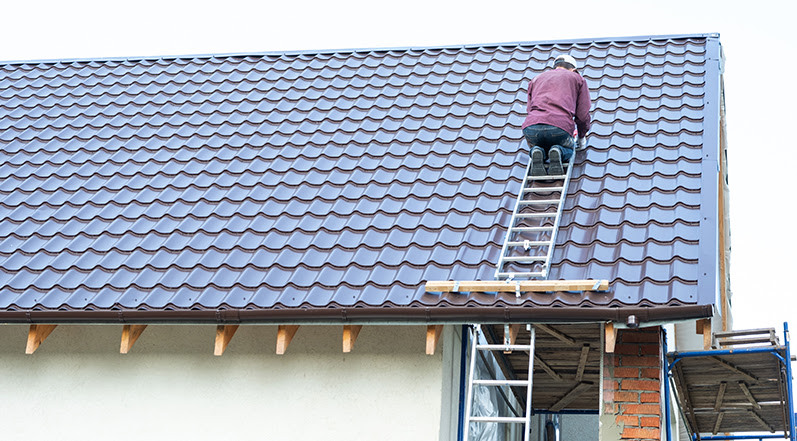 A Contractor Performing Roof Maintenance