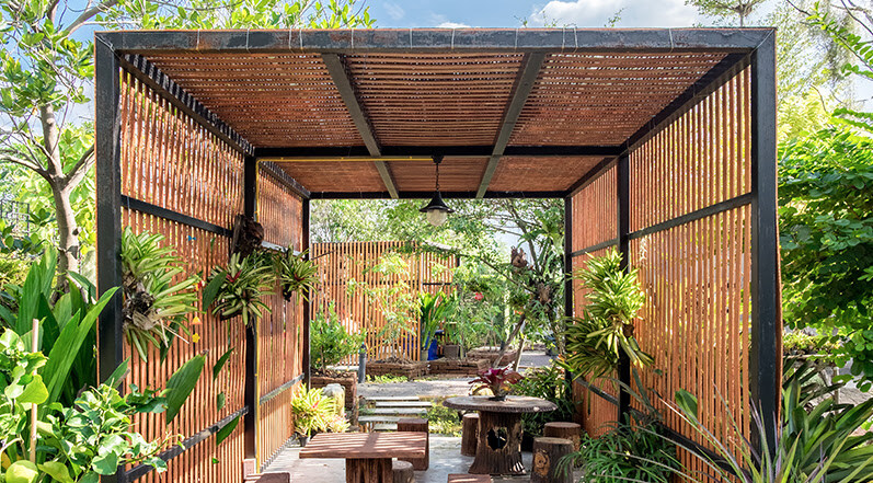 A Pergola With Wood Slat Roofing