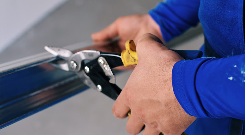 A Person Working With Metal