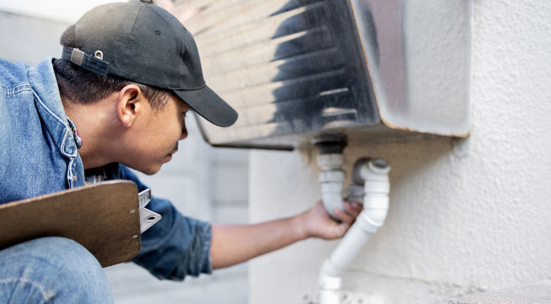 A Professional Inspecting Water Piping