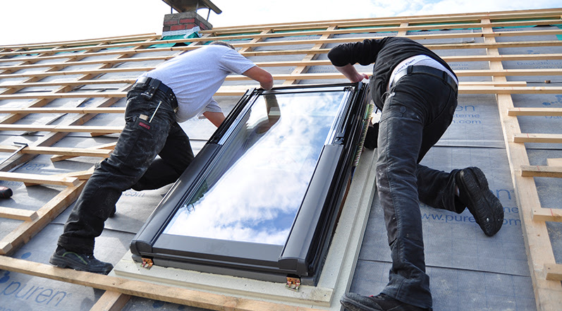 A Team Installing a Skylight