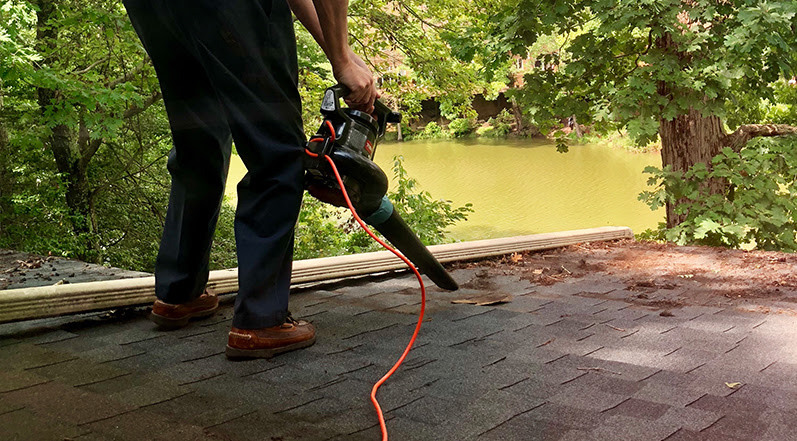 Clearing Leaves Off a Roof