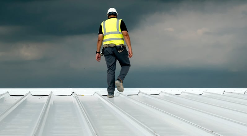 Contractor Inspecting a Roof