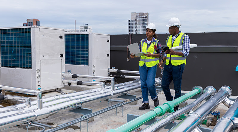 Contractors Inspecting HVAC Equipment