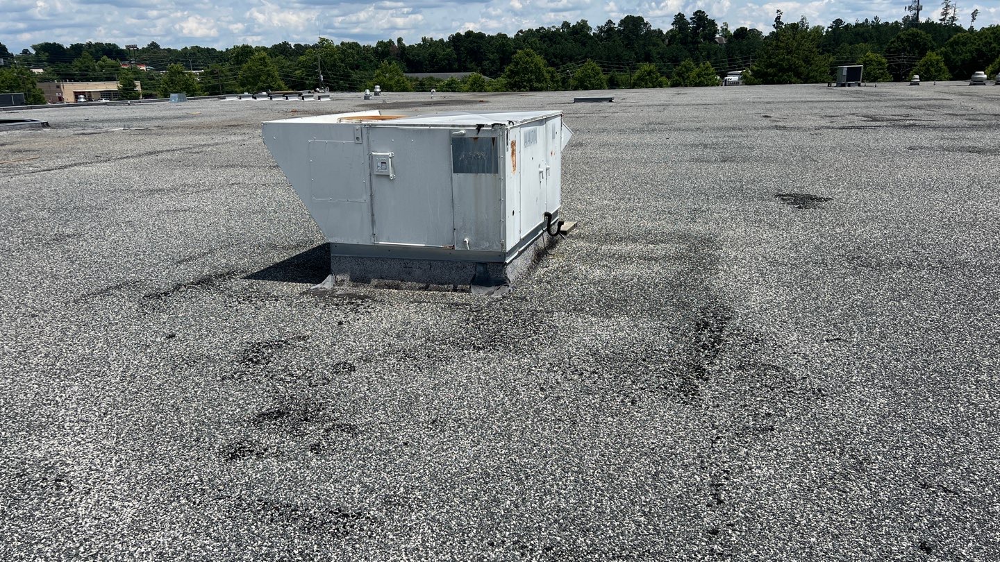 Picture of a built-up roof that needs to be replaced at the end of its useful life