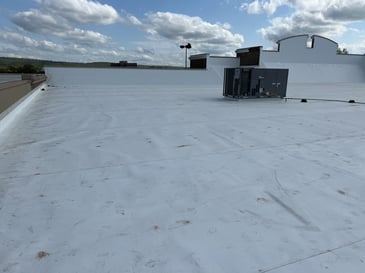 White TPO roof membrane on a shopping center roof in Alabama