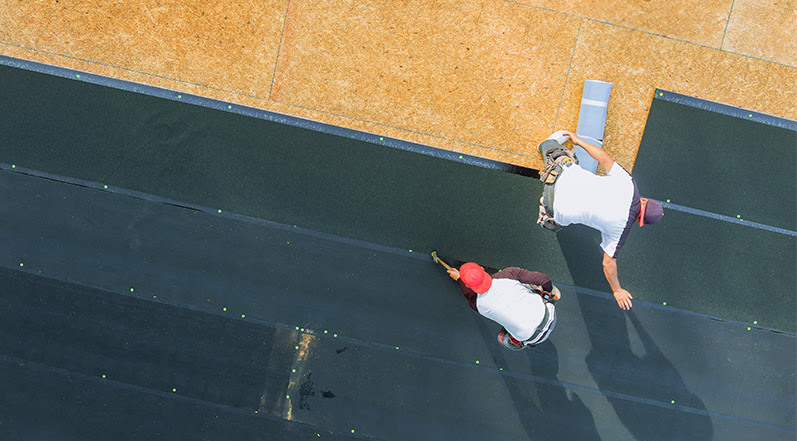 People Installing a New Roof