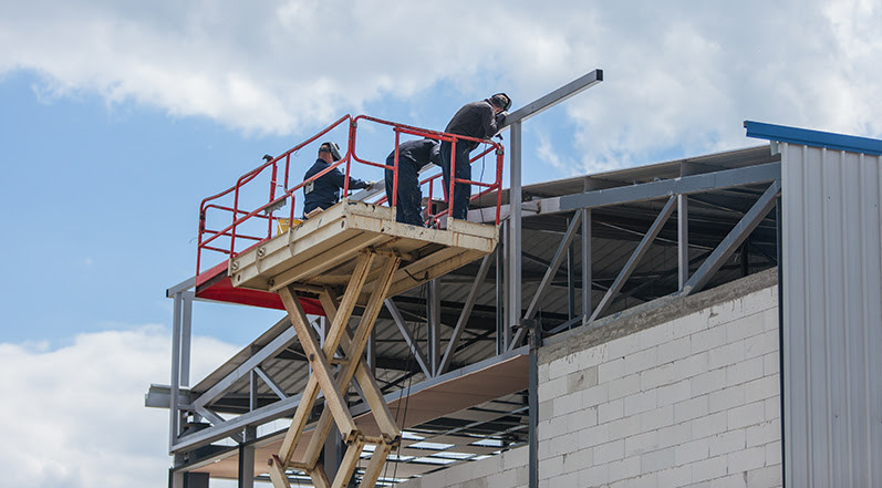 Roofing Contractors Installing a Metal Roof