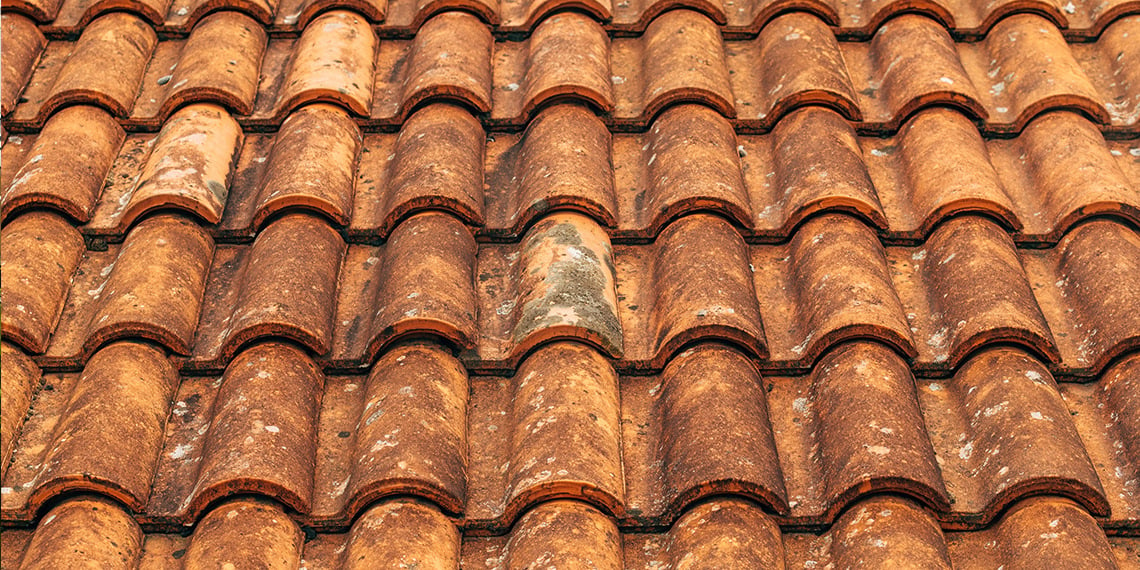 Fragment of green shingle tile texture roof for background